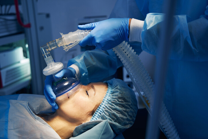 Anesthesia mask placed on the face of female patient