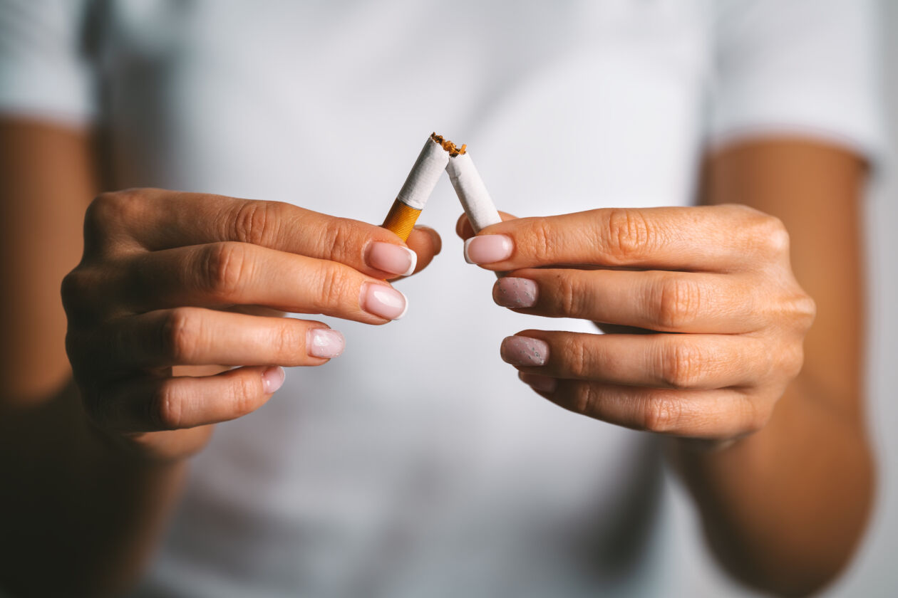 Woman brakes cigarette in hands. Woman refusing tobacco. Stop smoking, quit smoking or no smoking cigarettes dentistwesthollywoodcosmetic